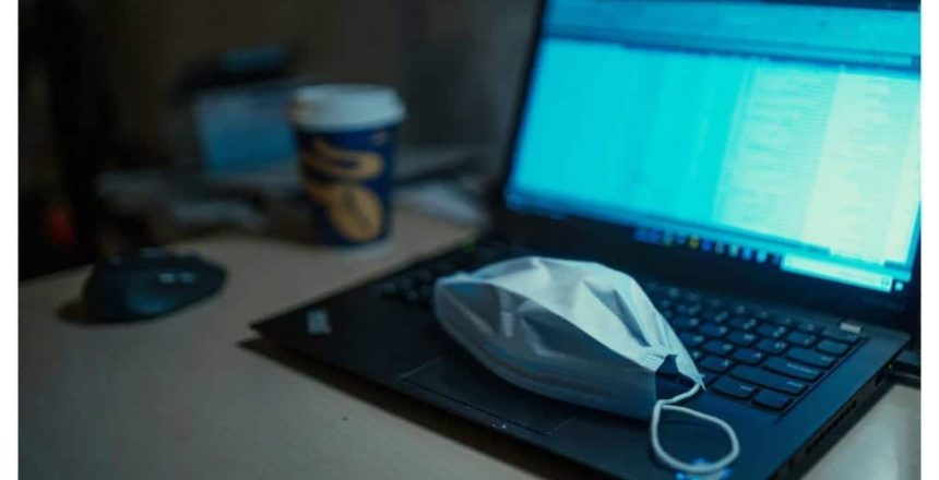 mask ontop of a laptop